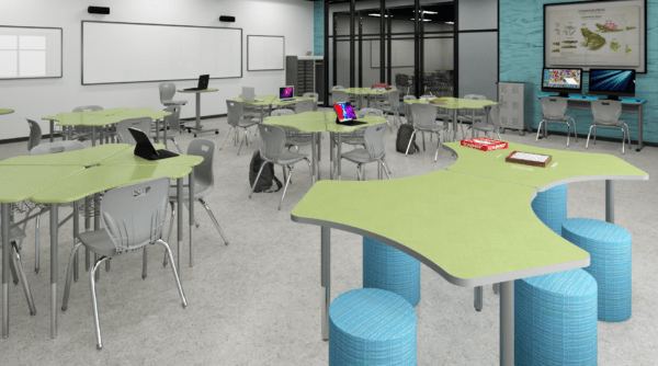 Glacier Boomerang desks in a classroom setting with chairs.
