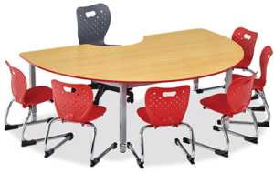 Kidney Shaped Table with six cantilever chairs around it and one teacher chair. Pictured on a white background.
