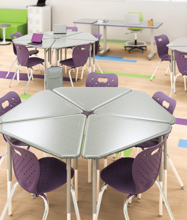Pente Desks arranged in groups of 5 in a classroom setting with purple 4 leg chairs.