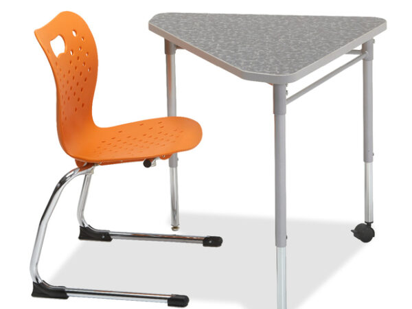 A Triangular Shaped desk with one caster on one of the legs. Pictured with a orange seated Cantilever Chair on a white background.