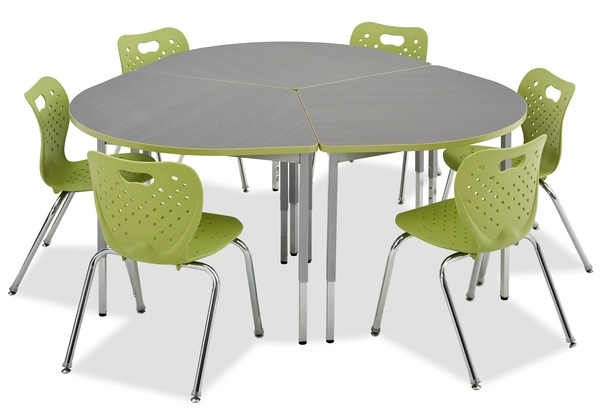 Three fan shaped tables put together to create one circular table. with six green chairs around on a white backgorund.
